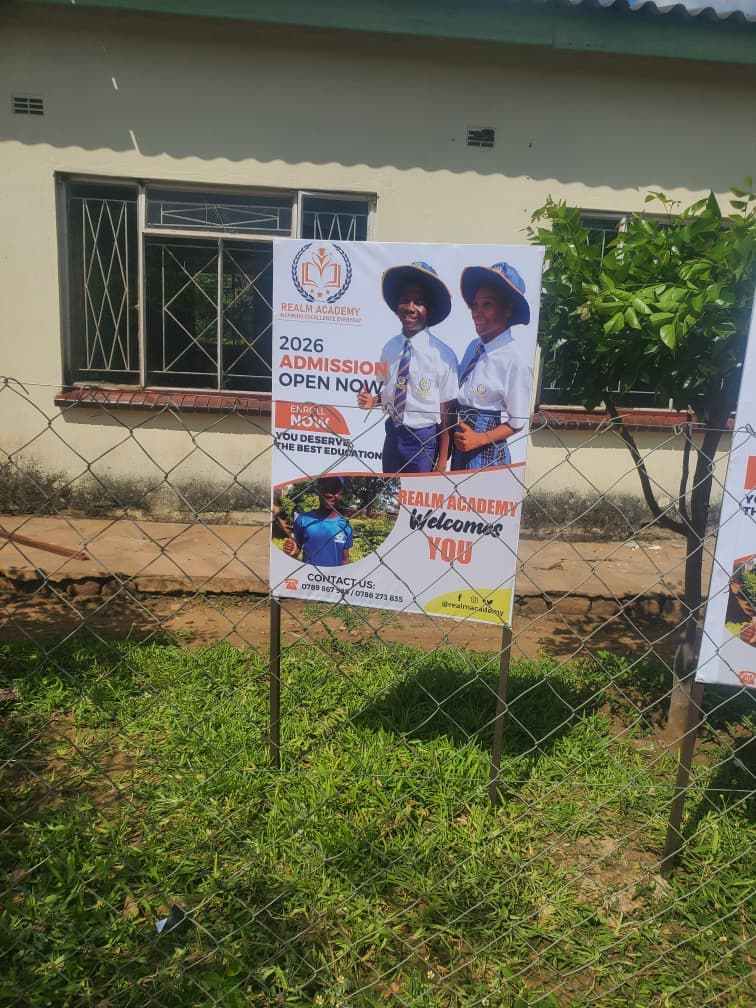 Realm admissions display outside a campus building