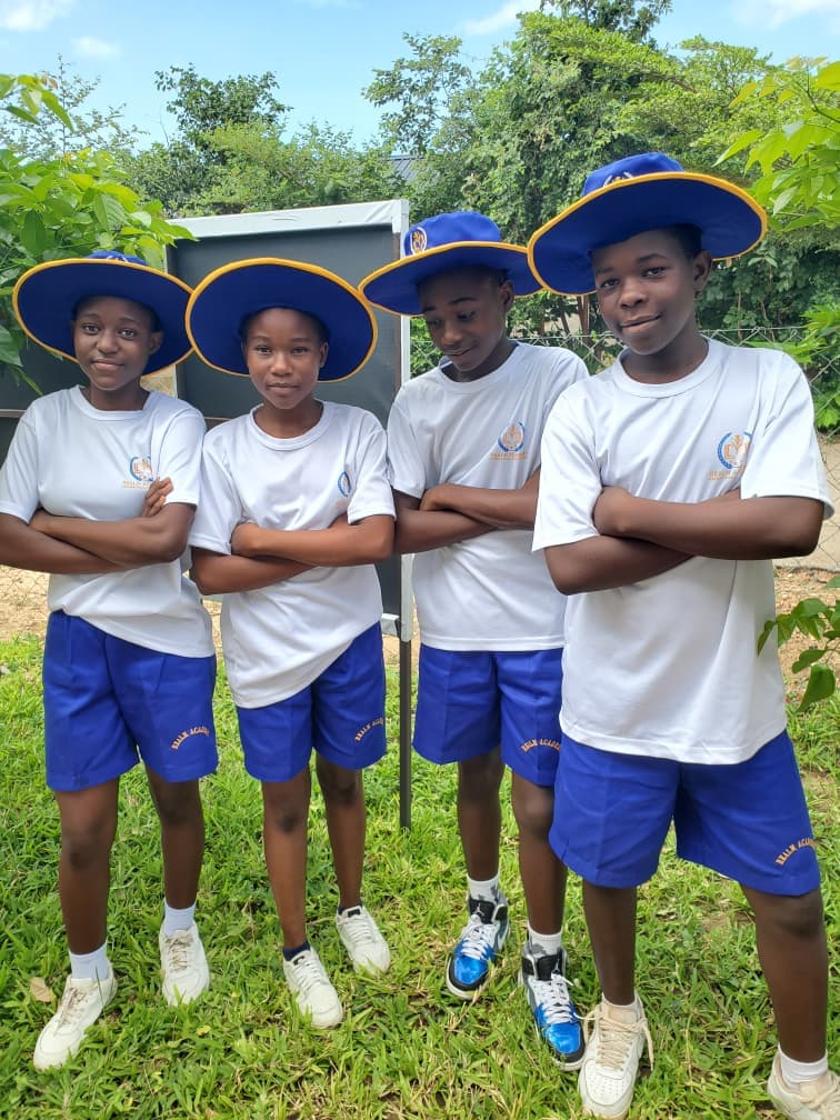 Realm students together outdoors in school sports uniform